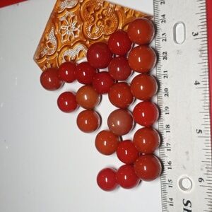 Lot of 22 Scratch That. 27 vintage glass marbles. Varied sizes. Red to browns